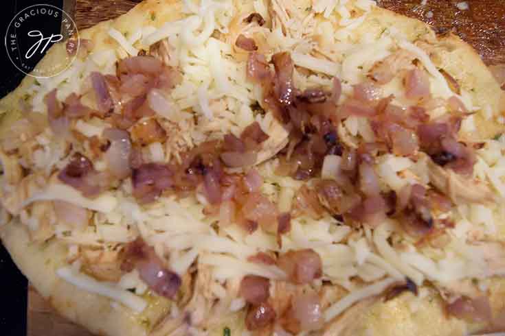 Sprinkle the sautéd onions over the cheese.