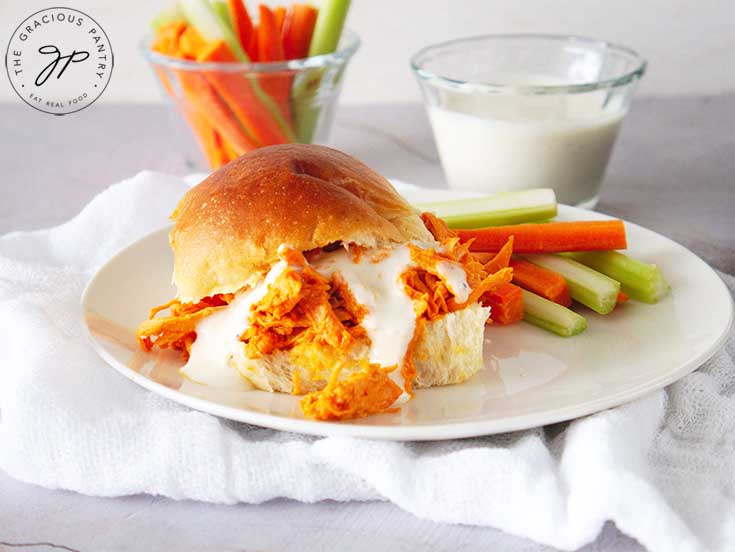 Serve on buns and drizzle with ranch.
