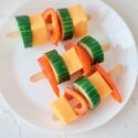 A plate of Cheese Kabobs on a white background.