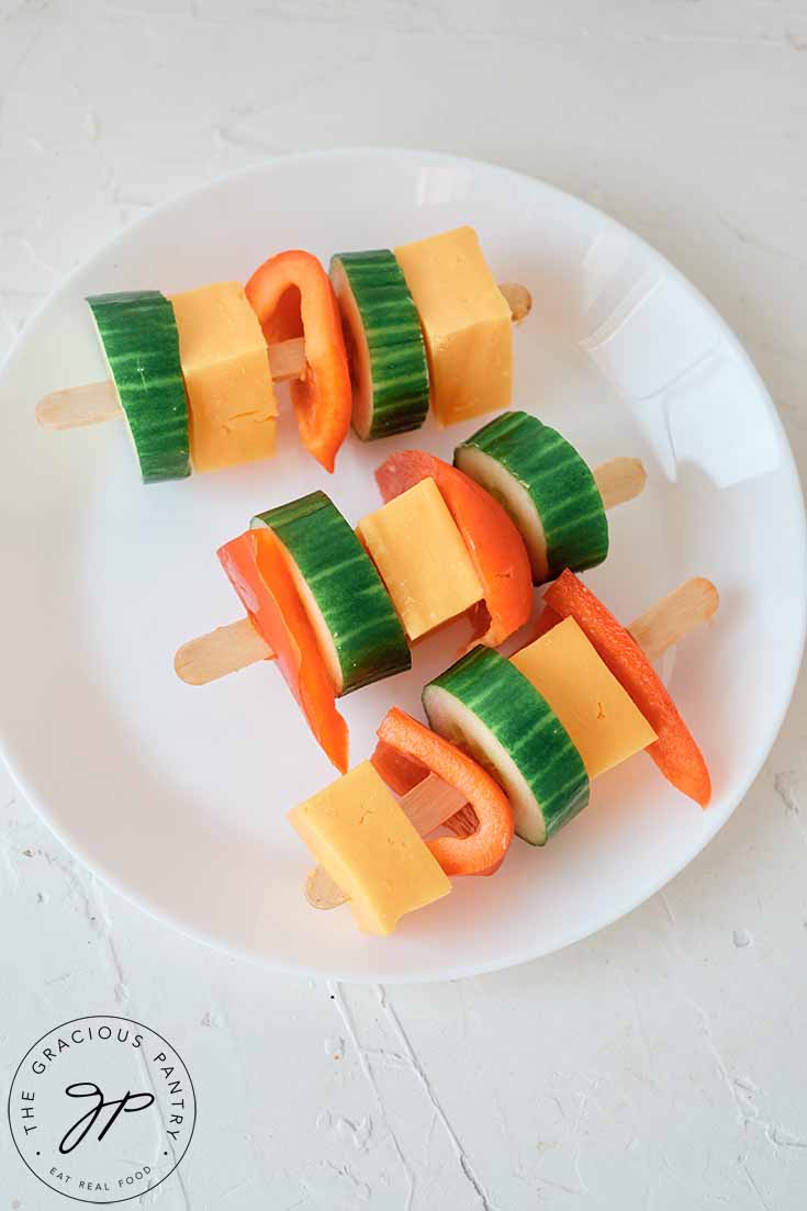 A plate of Cheese Kabobs on a white background.