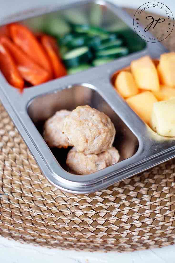 Chicken poppers in a bento-style lunchbox.