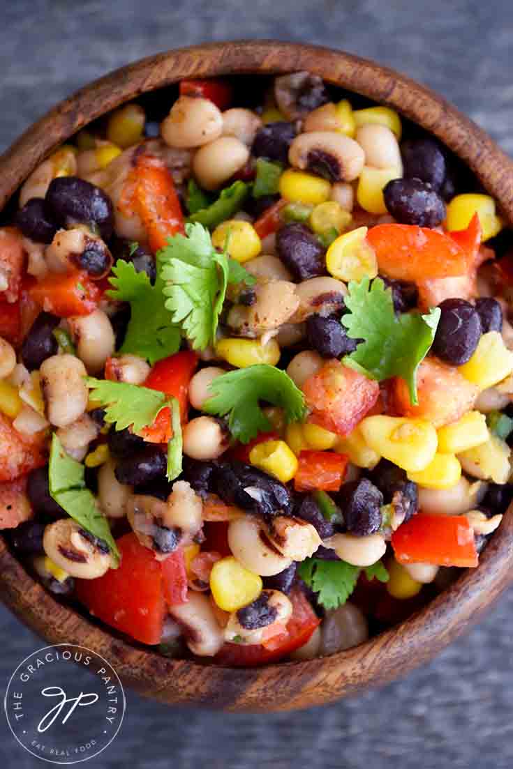 And overhead shot looking down into a wooden bowl filled with this Cowboy Caviar Recipe.