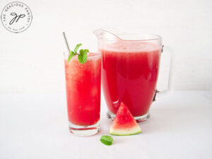 The finished pitcher and filled glass of Watermelon Agua Fresca With Mint.