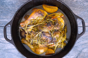 Horizontal overhead view of cooked dutch oven chicken.