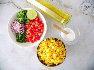 All ingredients gathered together to make this corn salsa recipe.