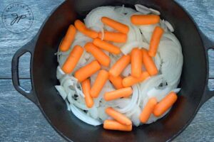 Carrots and onions in the dutch oven.