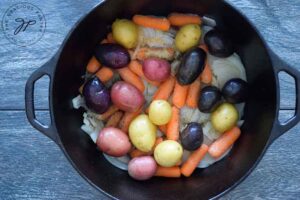 Small potatoes on top of the carrots.