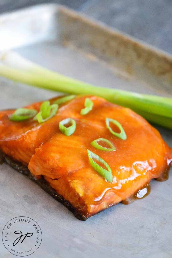 A single Teriyaki Salmon Fillet rests on a baking sheet.