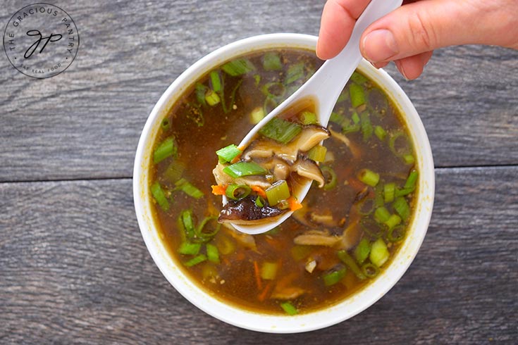 Shiitake Mushroom Soup served in a white bowl.