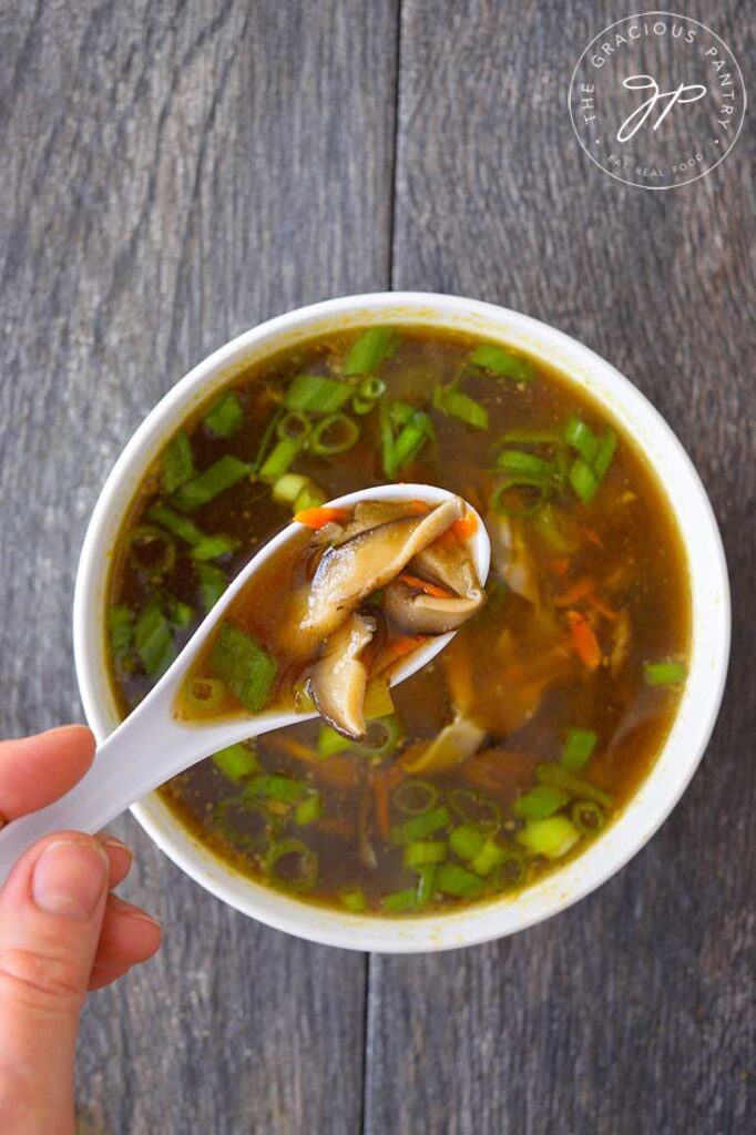 And overhead shot looking down into a white bowl filled with this Asian Mushroom Soup.