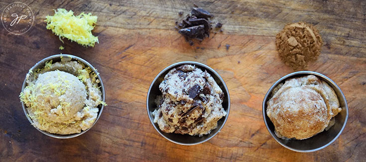 Three scoops of edible cookie dough with different flavors; Lemon, chocolate chip and snickerdoodle.