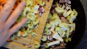 Put all the veggies in the pan for sautéing.