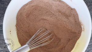 The mug cake mix ingredients whisked together in the mixing bowl.
