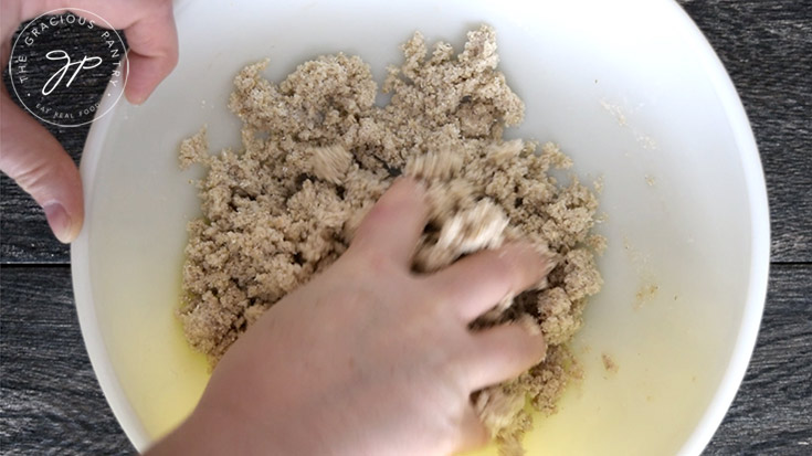 Kneading everything together in the mixing bowl.