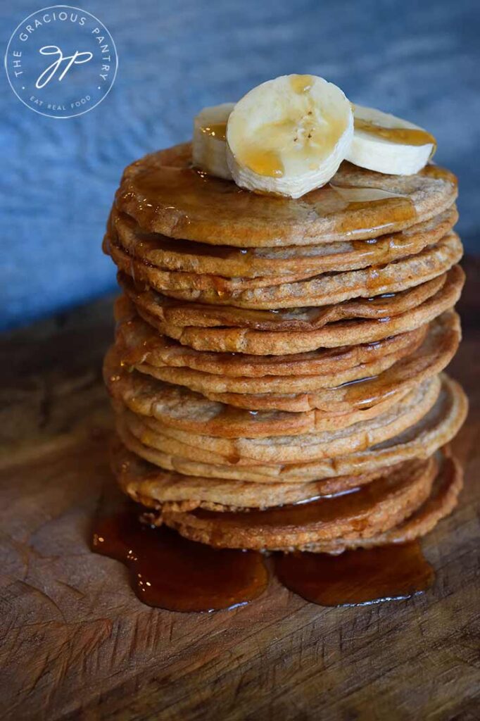 A side view of a tall stack of banana pancakes.