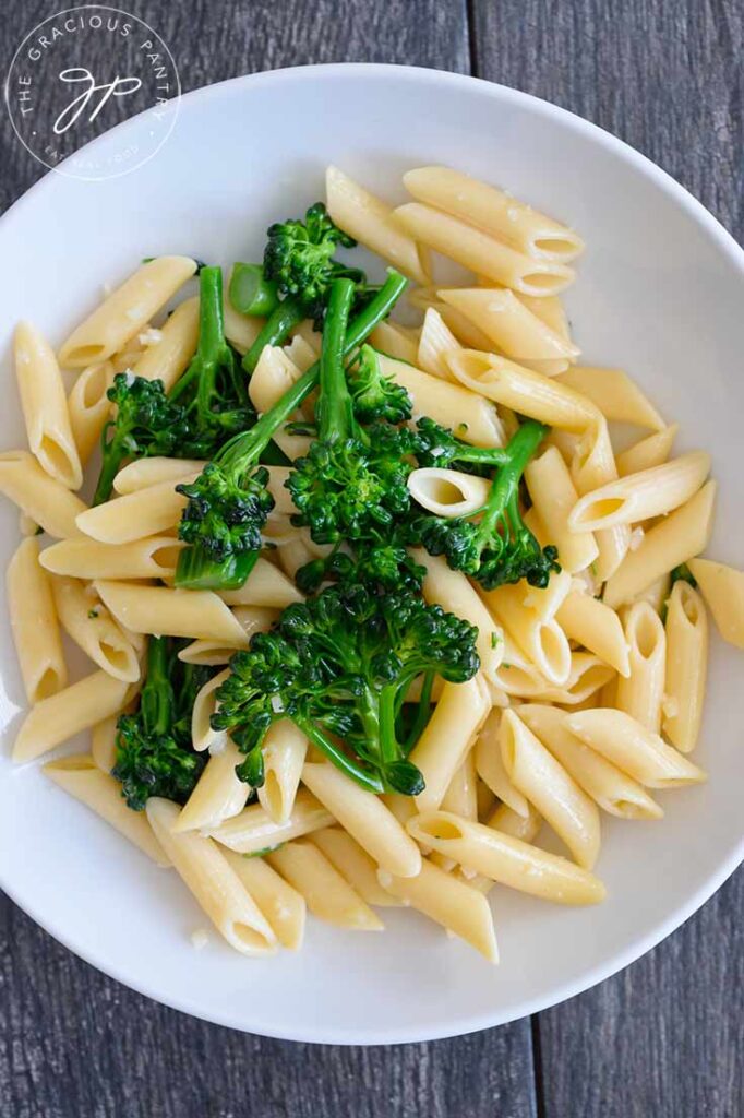 Garlicky Broccolini Pasta served in a white bowl, awaiting garnish.