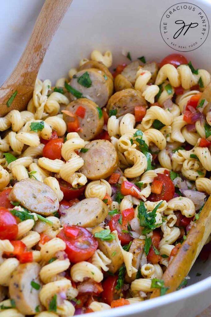 Up close shot of the finished cavatappi pasta in a white bowl.