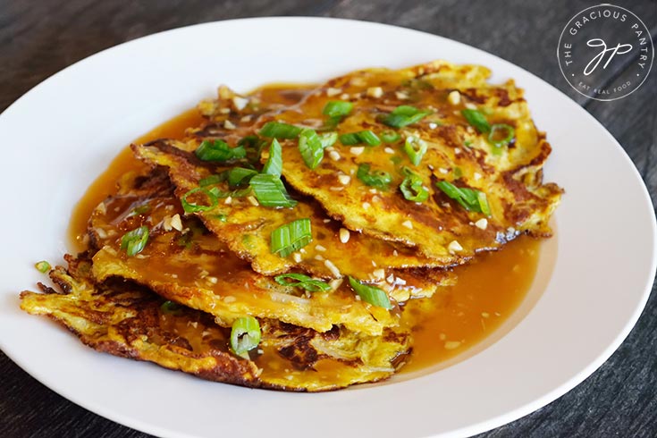 The plated egg foo young, ready to serve and eat.