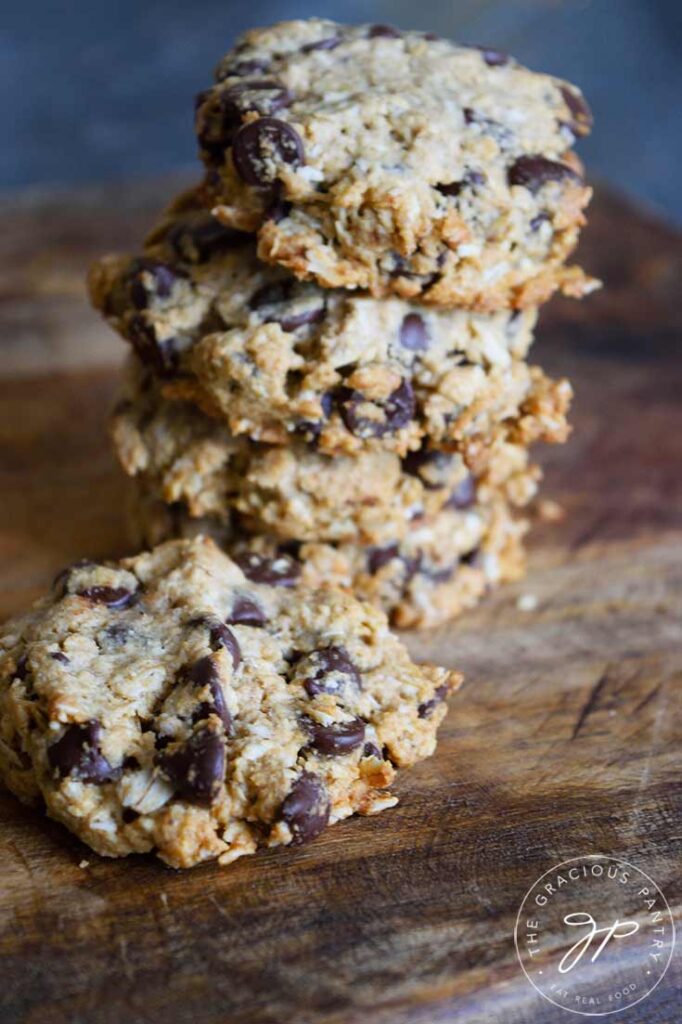 Oatmeal Chocolate Chip Cookies stacked on a cutting board.