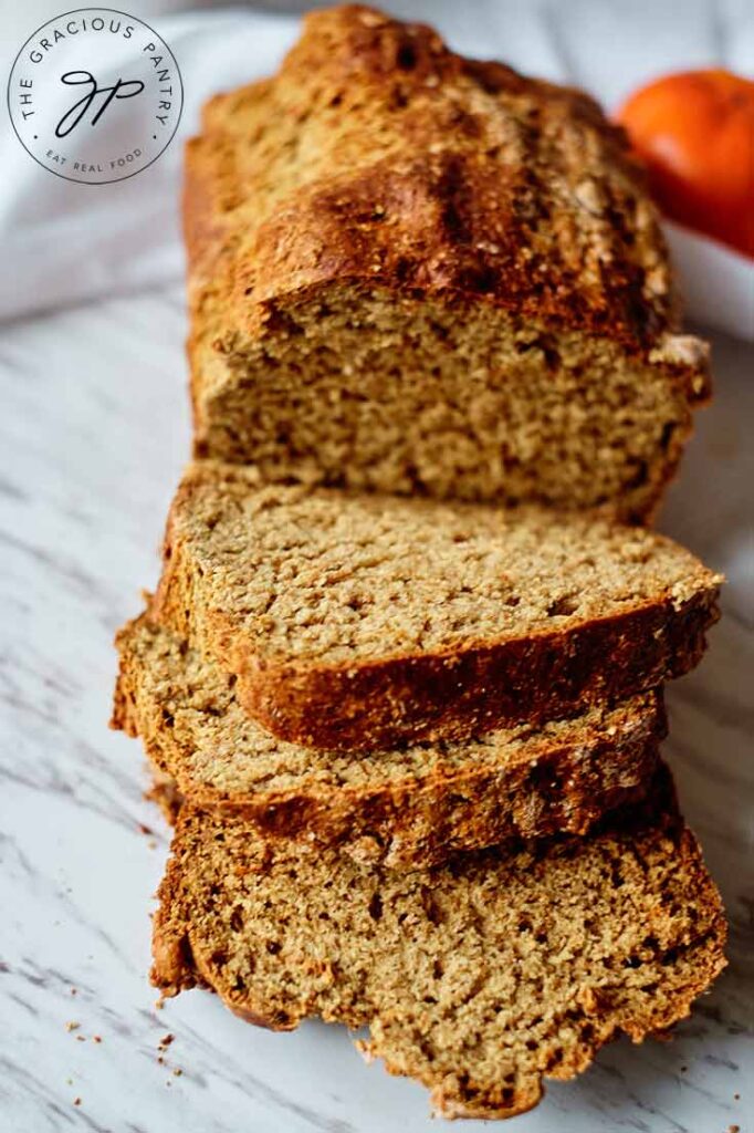 Three slices of bread cut off of the loaf of Persimmon Bread.