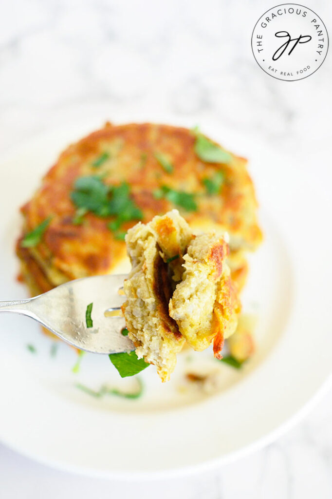 A bite of this Potato Pancake Recipe on a fork, made with this potato pancake recipe.