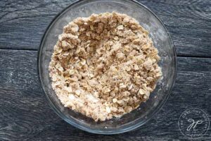 The crumb topping mixed together in a glass bowl.