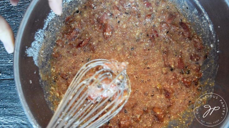 The egg mixture all whisked together for the sauce that will make hold together this spaghetti pie.