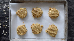 The cookie dough flattened on the cookie sheet.