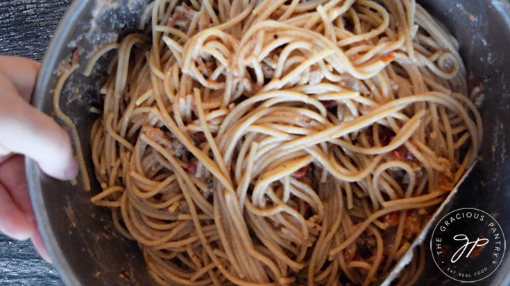 The pasta mixed into the egg and meat mixture.