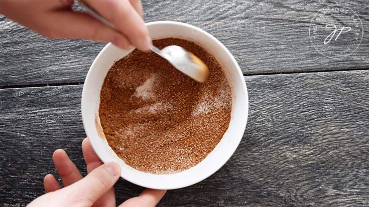 Mixing the cinnamon sugar in a small bowl for the swirl.