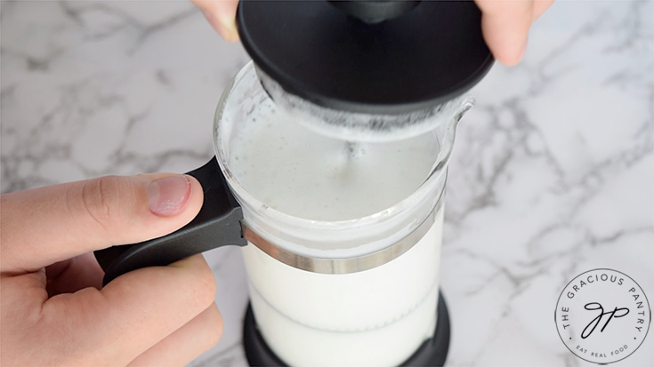 Frothing the milk in a french press for a London fog.