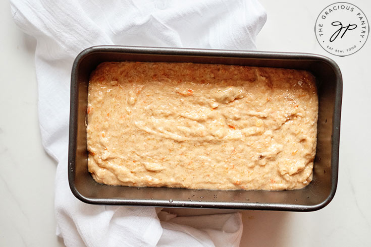 The persimmon bread batter in a loaf pan, ready to bake.