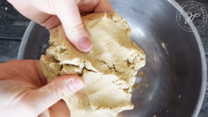 Showing the soft but firm texture of the finished dough up close.