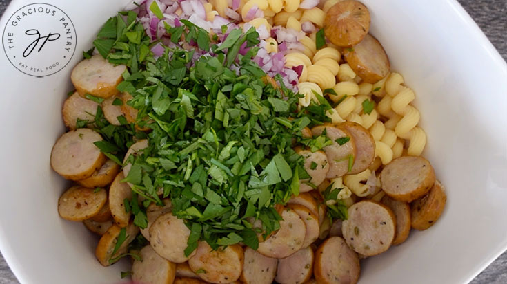 Fresh herbs added to the cavatappi pasta.