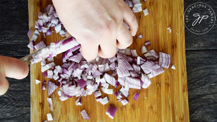 Chopping the onions for this lasagna soup recipe.