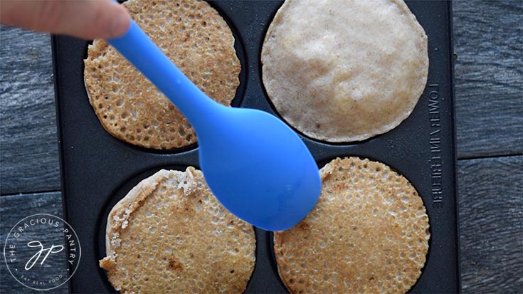 Flipping the pancakes.