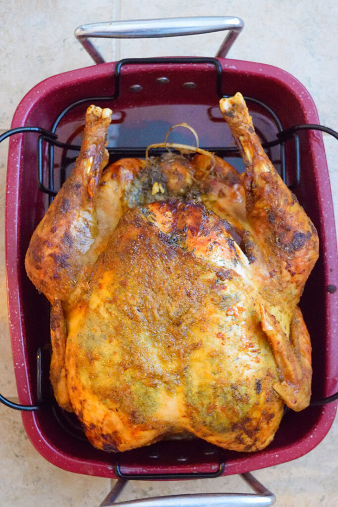 An overhead view of this Thanksgiving Turkey Recipe, looking down at the turkey in it's roasting pan.