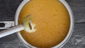 The blended Bacon Sweet Potato Soup in a pot.