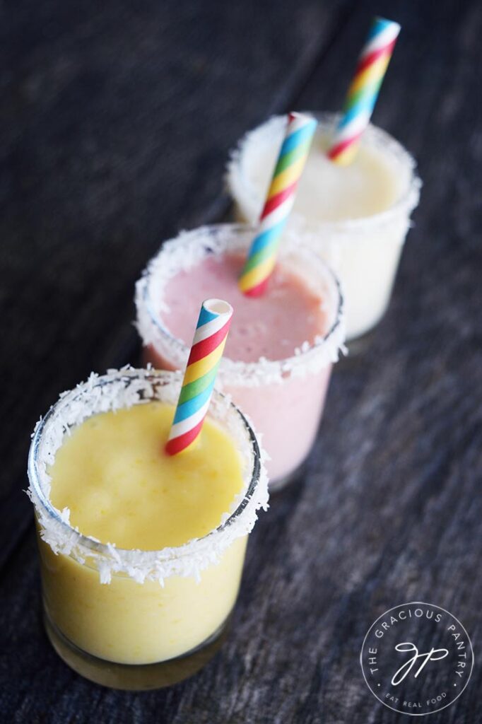 Coconut Milk Smoothie in three glasses in three different colors and flavors.