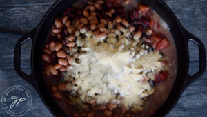 Adding all the spices to this Dutch Oven Chili Recipe