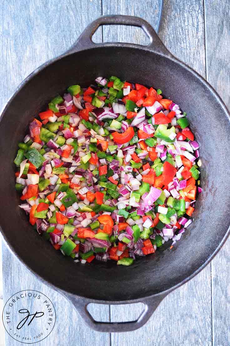 Vegetables sautéing in a dutch oven. The first step in making this Dutch Oven Chili Recipe.