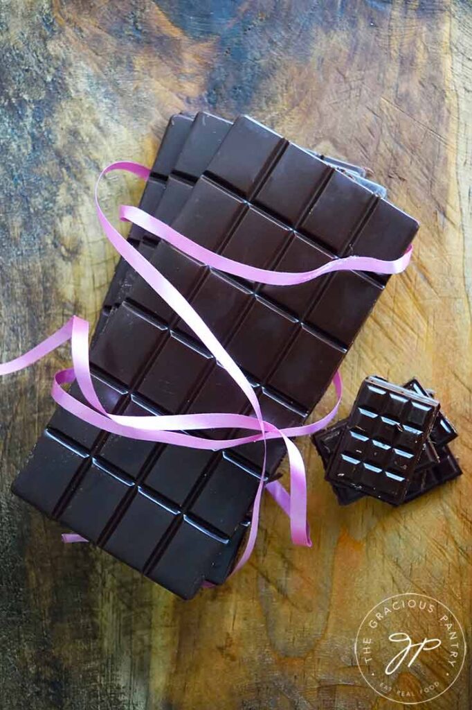 An overhead view of two stacks of chocolate bars. A stack of large bars and a stack of mini bars made from this chocolate bars recipe.