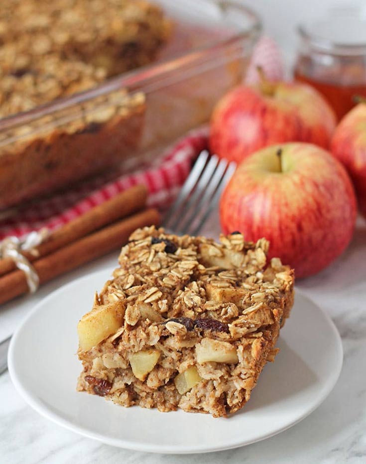 A slice of Vegan Baked Apple Oatmeal sits on a plate, ready to eat.