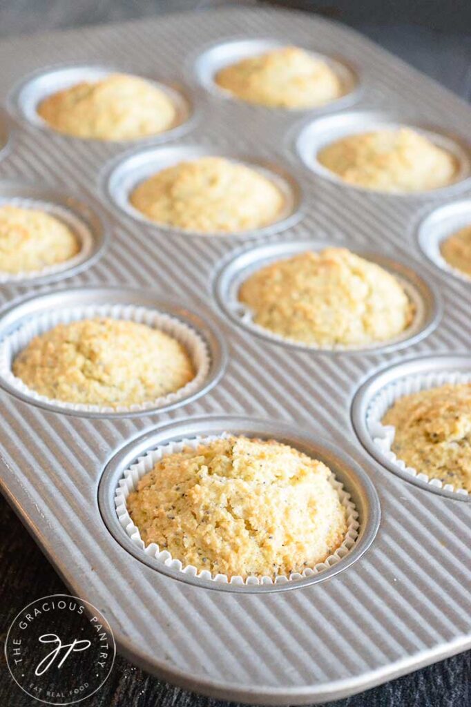 Just baked Gluten Free Lemon Poppy Seed Muffins still in their baking pan cooling.