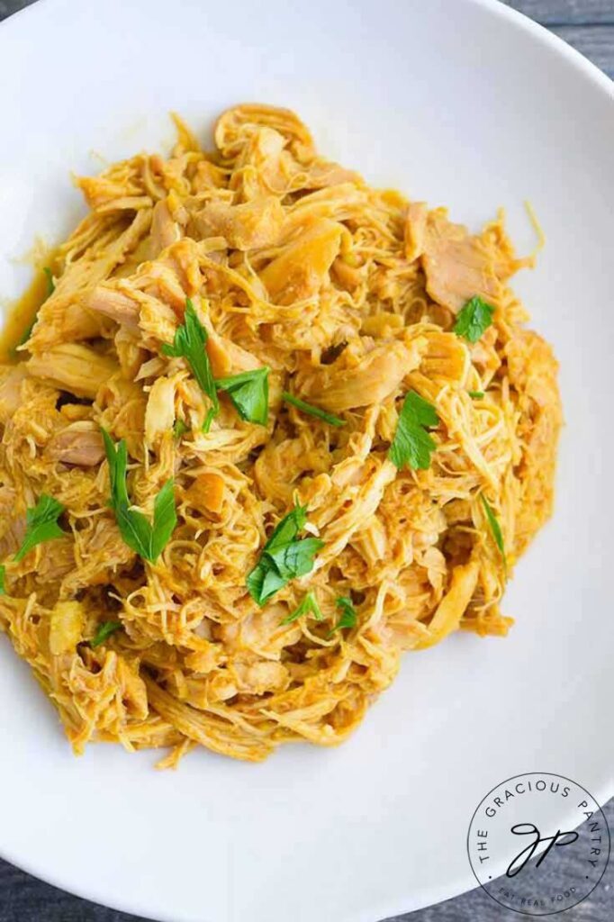 An overhead view looking down into a white bowl filled with this Honey Mustard Chicken Recipe