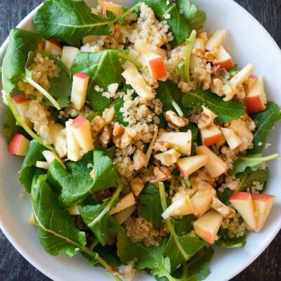 An overhead view of this Kale Quinoa Salad in a white bowl.