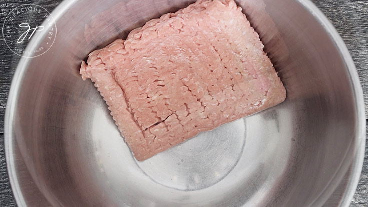 Step one of this Kofta Curry Recipe is to put the ground turkey into a large mixing bowl.