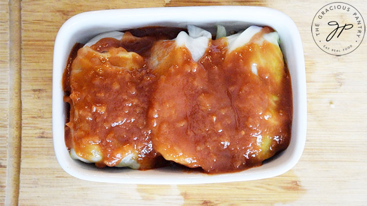 Salsa poured over the cabbage rolls.
