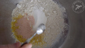 Mixing all the dry ingredients together for these Oat Crackers.