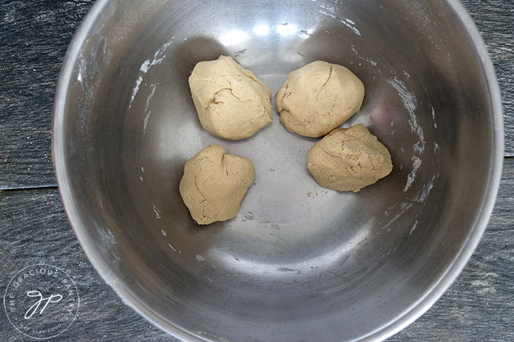 The oat crackers dough split into four equal portions.